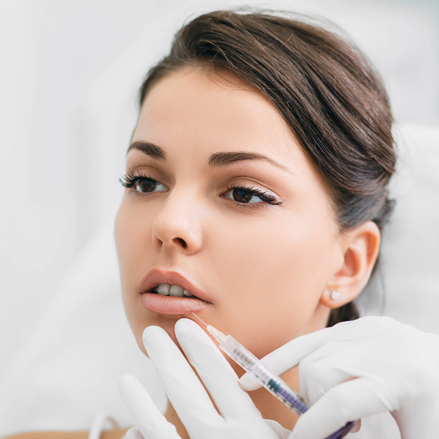 woman having lip injections procedure lip augment Aesthetic Treatments heailBOX Medical Clinics 4 Image